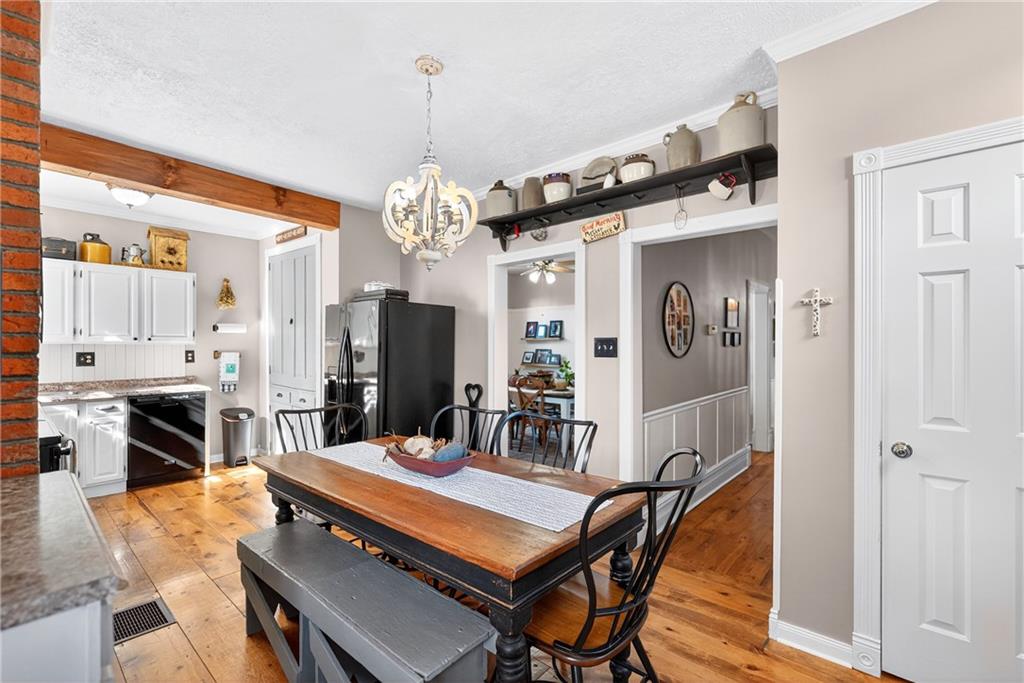 722 8th Street Irwin, PA 15642 - Photo 17 of 50 a view of a dining room with furniture and wooden floor