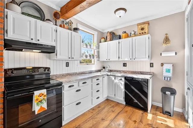 a kitchen with stainless steel appliances granite countertop a stove and a refrigerator