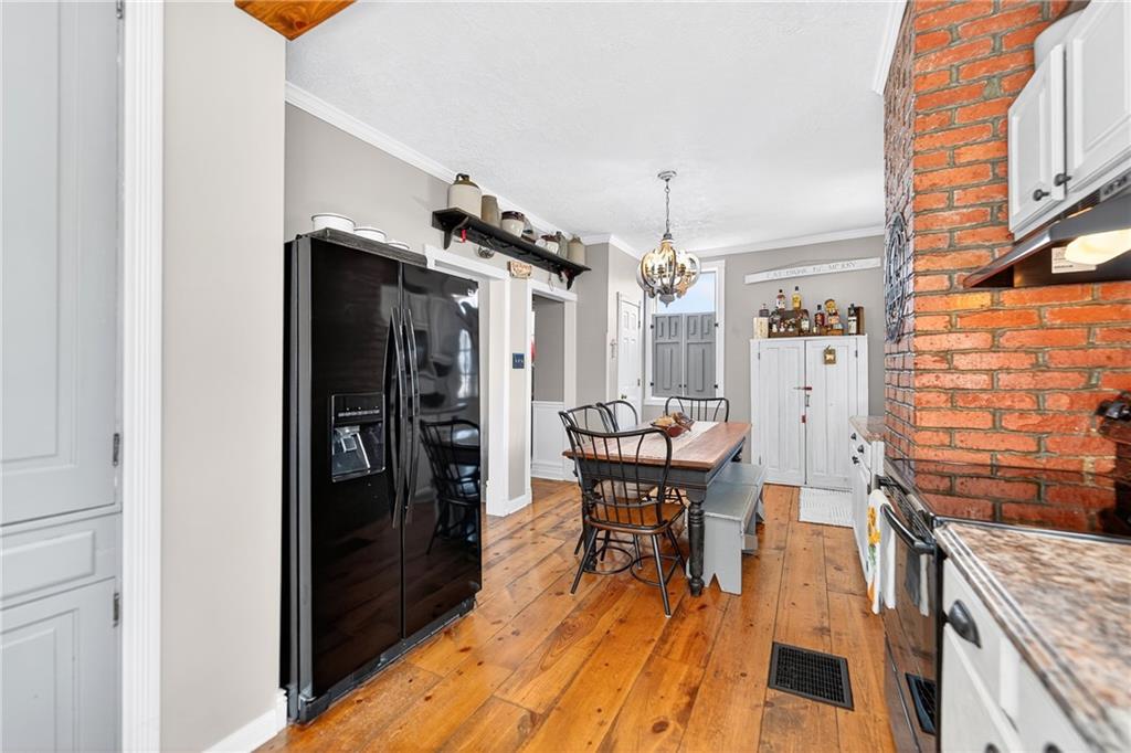 722 8th Street Irwin, PA 15642 - Photo 20 of 50 a view of a kitchen from a dining room