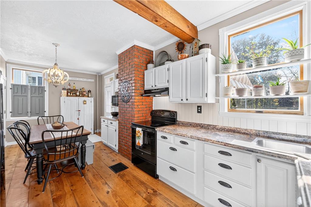722 8th Street Irwin, PA 15642 - Photo 21 of 50 a kitchen with granite countertop a sink appliances cabinets and furniture