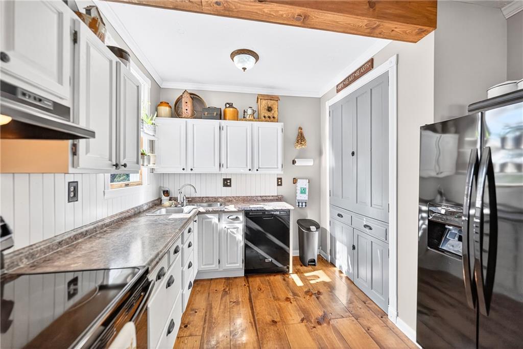 722 8th Street Irwin, PA 15642 - Photo 22 of 50 a kitchen with a sink stove and refrigerator