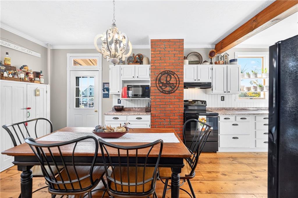 722 8th Street Irwin, PA 15642 - Photo 23 of 50 a view of a dining room with furniture and chandelier