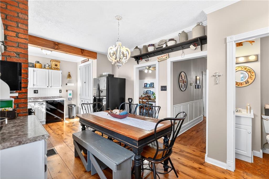 722 8th Street Irwin, PA 15642 - Photo 24 of 50 a outdoor dining space with furniture and a chandelier