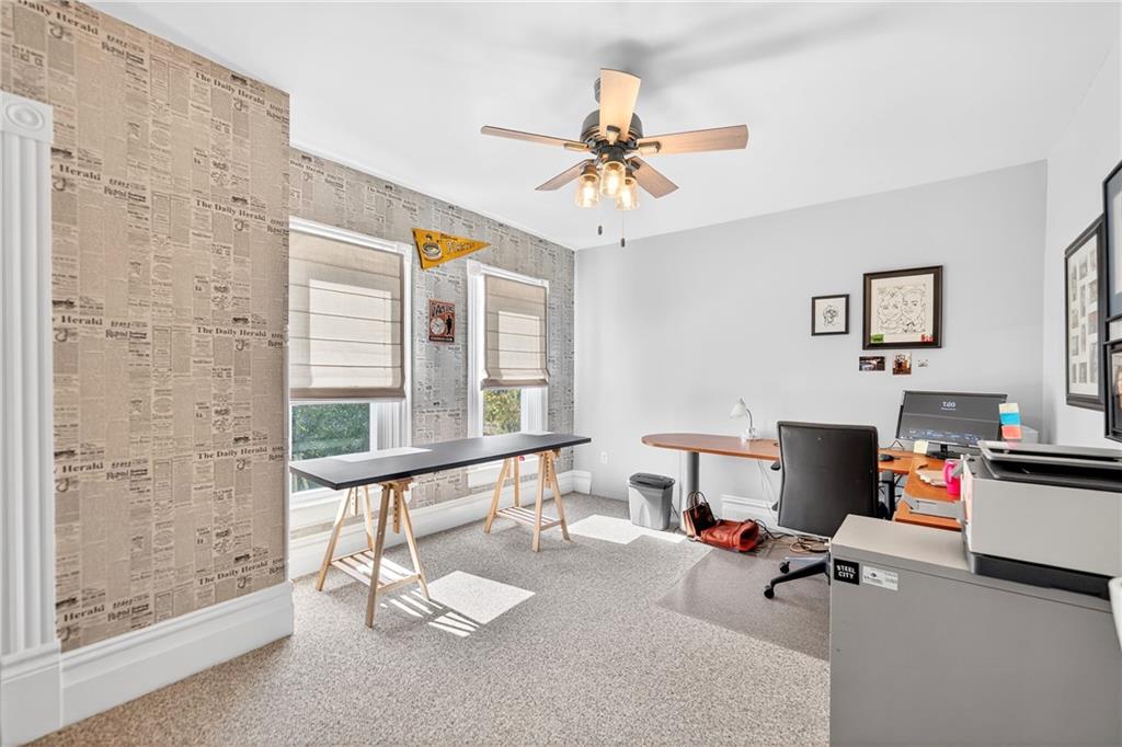 722 8th Street Irwin, PA 15642 - Photo 26 of 50 a living room with furniture and a floor to ceiling window