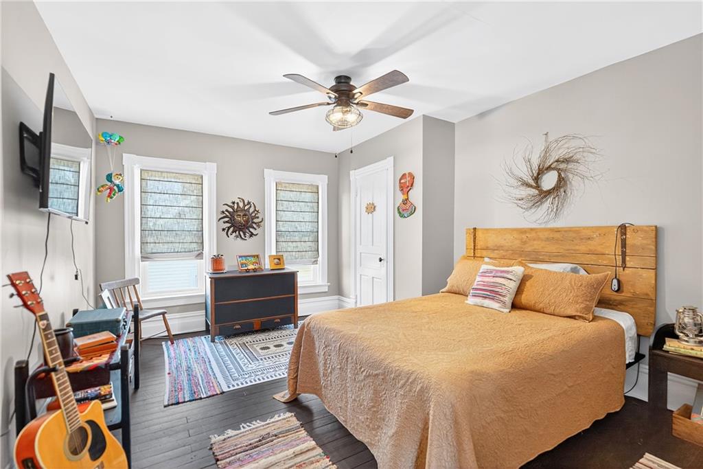 722 8th Street Irwin, PA 15642 - Photo 27 of 50 a bedroom with a bed and wooden floor