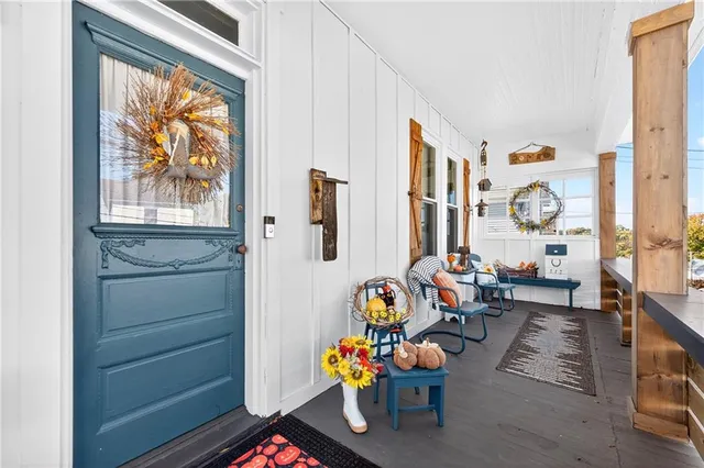 a living room with patio furniture and a window