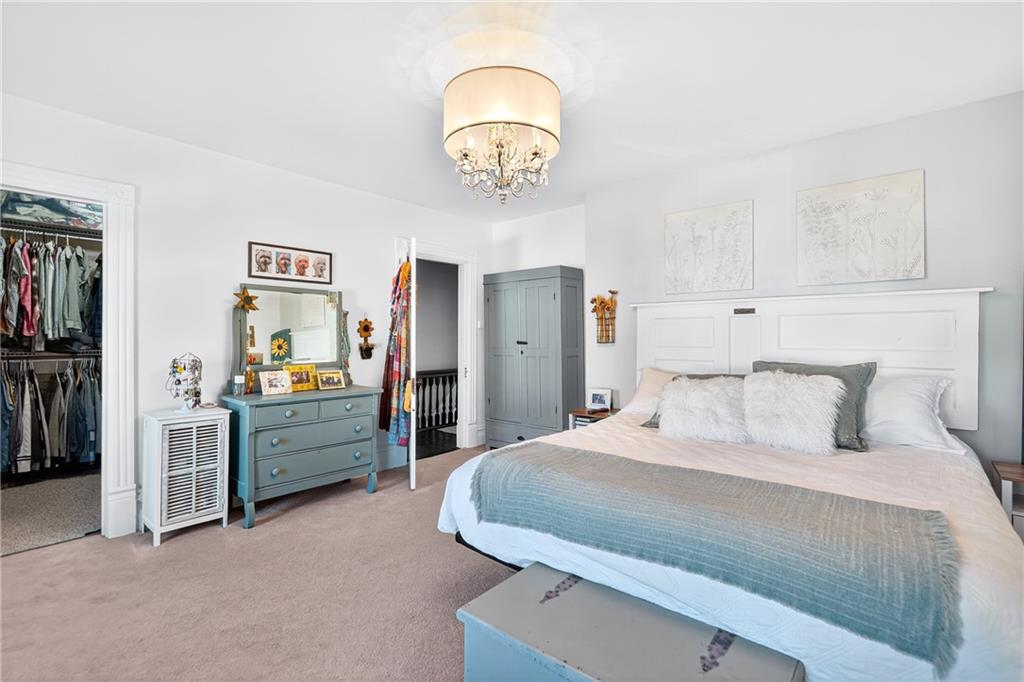 722 8th Street Irwin, PA 15642 - Photo 32 of 50 a bedroom with a bed and a chandelier