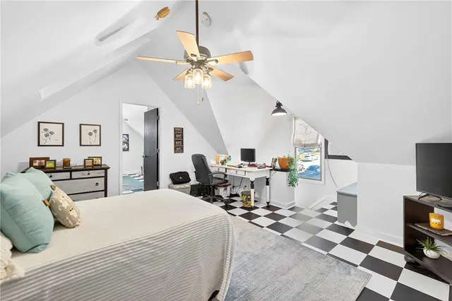 a very nice looking room with a large bed and a chandelier