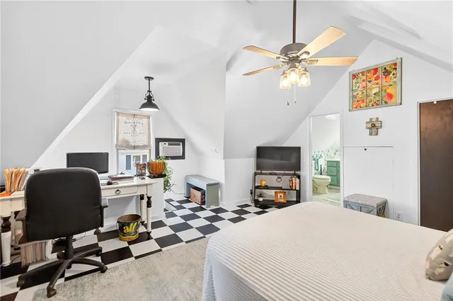 a bedroom with furniture and a bed