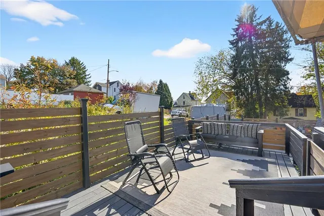 a view of a patio with a table and chairs