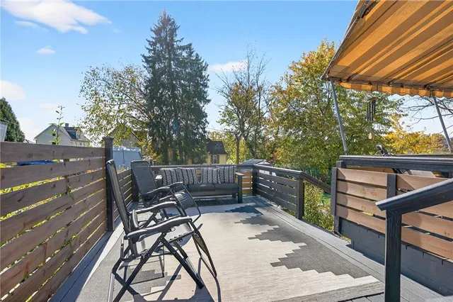 a view of a backyard with sitting area