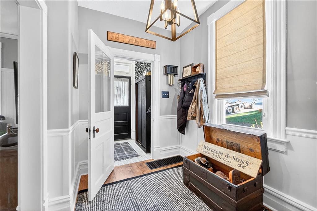 722 8th Street Irwin, PA 15642 - Photo 6 of 50 a picture of a room with wooden floor windows and entryway