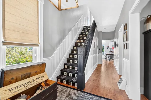 a view of an entryway with wooden floor