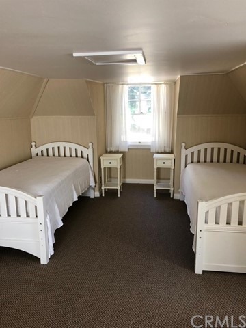 933 Oak Road Skyforest, CA 92385 - Photo 11 of 31 a bedroom with furniture and windows