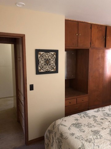 933 Oak Road Skyforest, CA 92385 - Photo 13 of 31 a bedroom with a bed and a dresser