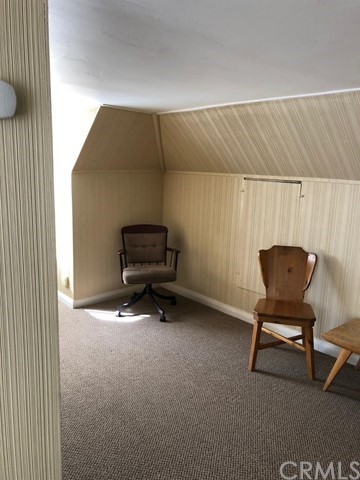 933 Oak Road Skyforest, CA 92385 - Photo 21 of 31 a living room with furniture and a chair