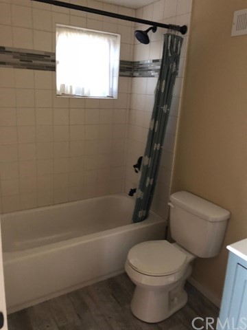 933 Oak Road Skyforest, CA 92385 - Photo 22 of 31 a white toilet sitting next to a bath tub