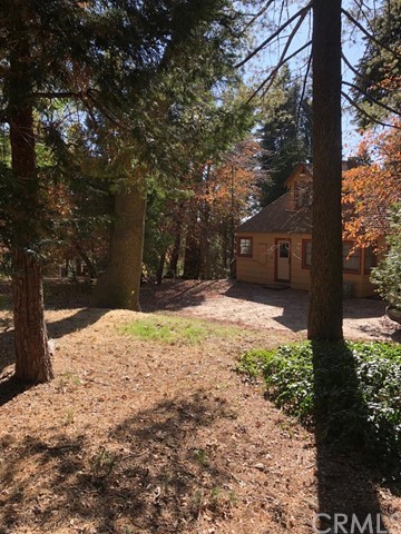 933 Oak Road Skyforest, CA 92385 - Photo 29 of 31 a house with trees in front of it