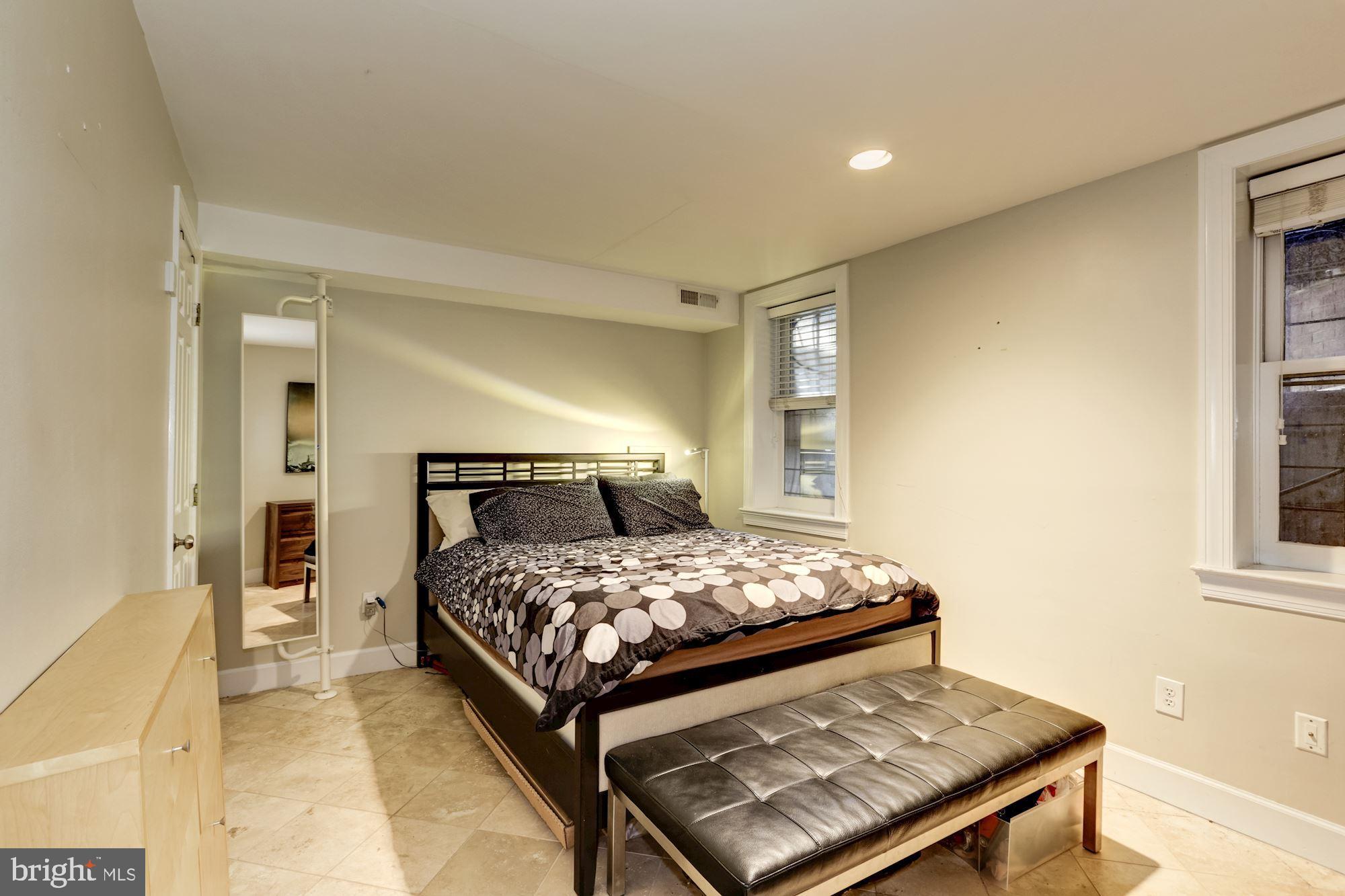 1630 19th Street Northwest, Unit B2 Washington, DC 20009 - Photo 11 of 19 a bedroom with a bed and a window