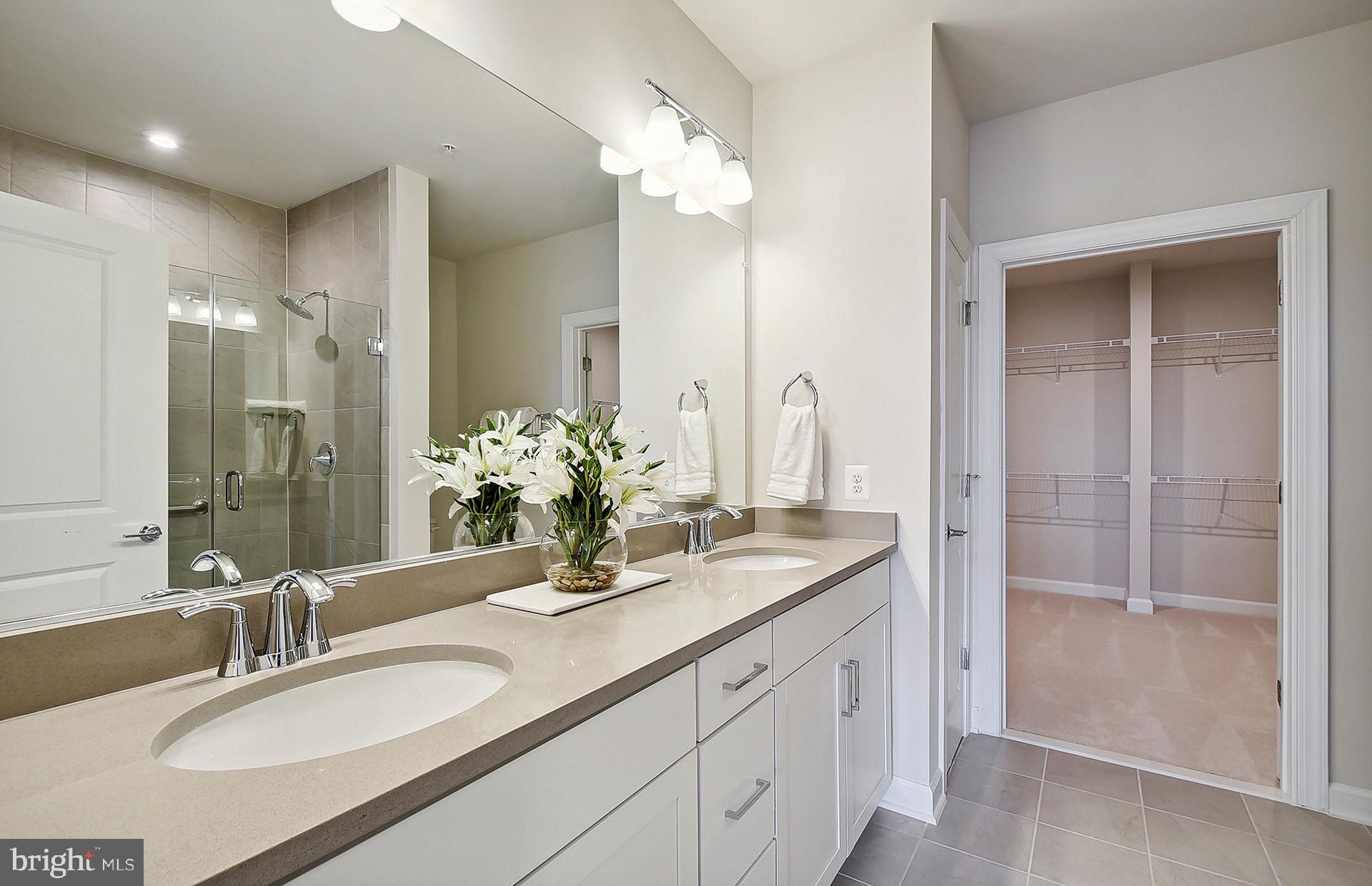 5800 Moonstone Way, Unit 2 Haymarket, VA 20169 - Photo 8 of 35 a bathroom with double vanity sinks and a mirror