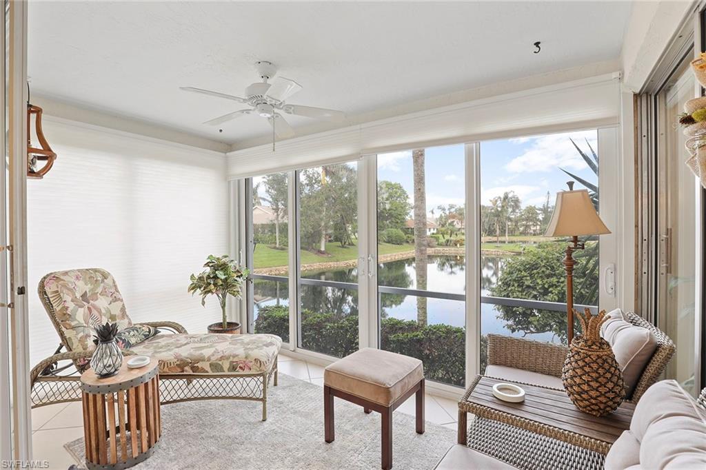 84 Georgetown Boulevard, Unit 84 Naples, FL 34112 - Photo 6 of 17 Slider enclosed porch with lake view