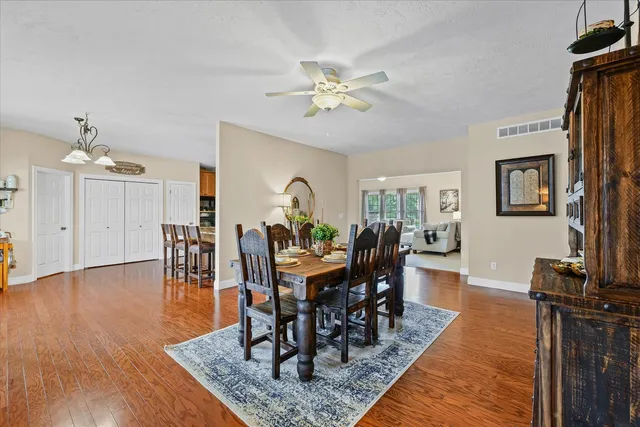 a view of kitchen and dining room with wooden floor
