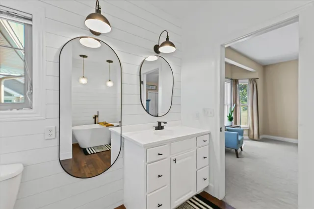 a bed room with a bed and a chandelier