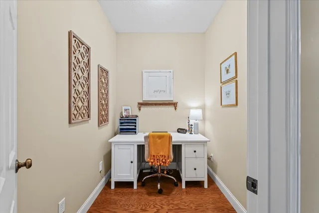 a spacious bedroom with a bed and a chandelier