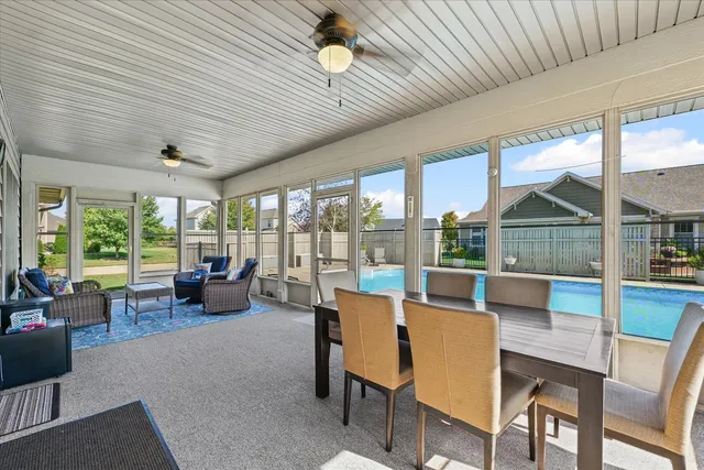 a view of a backyard with sitting area