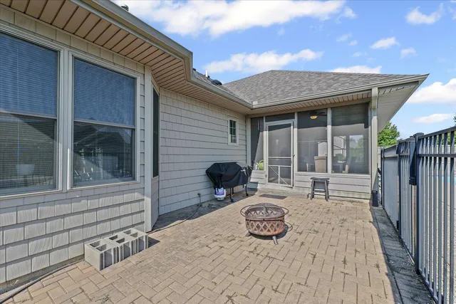 a front view of house with yard and outdoor seating