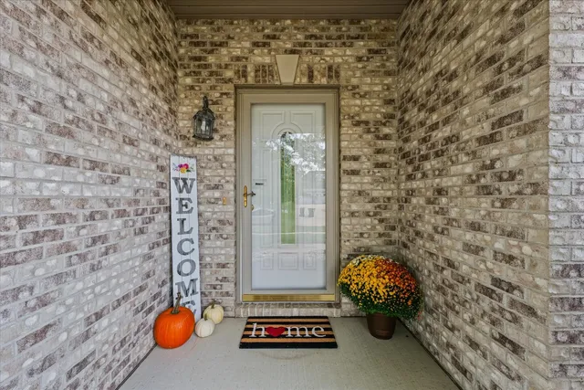 a front view of a house with chairs