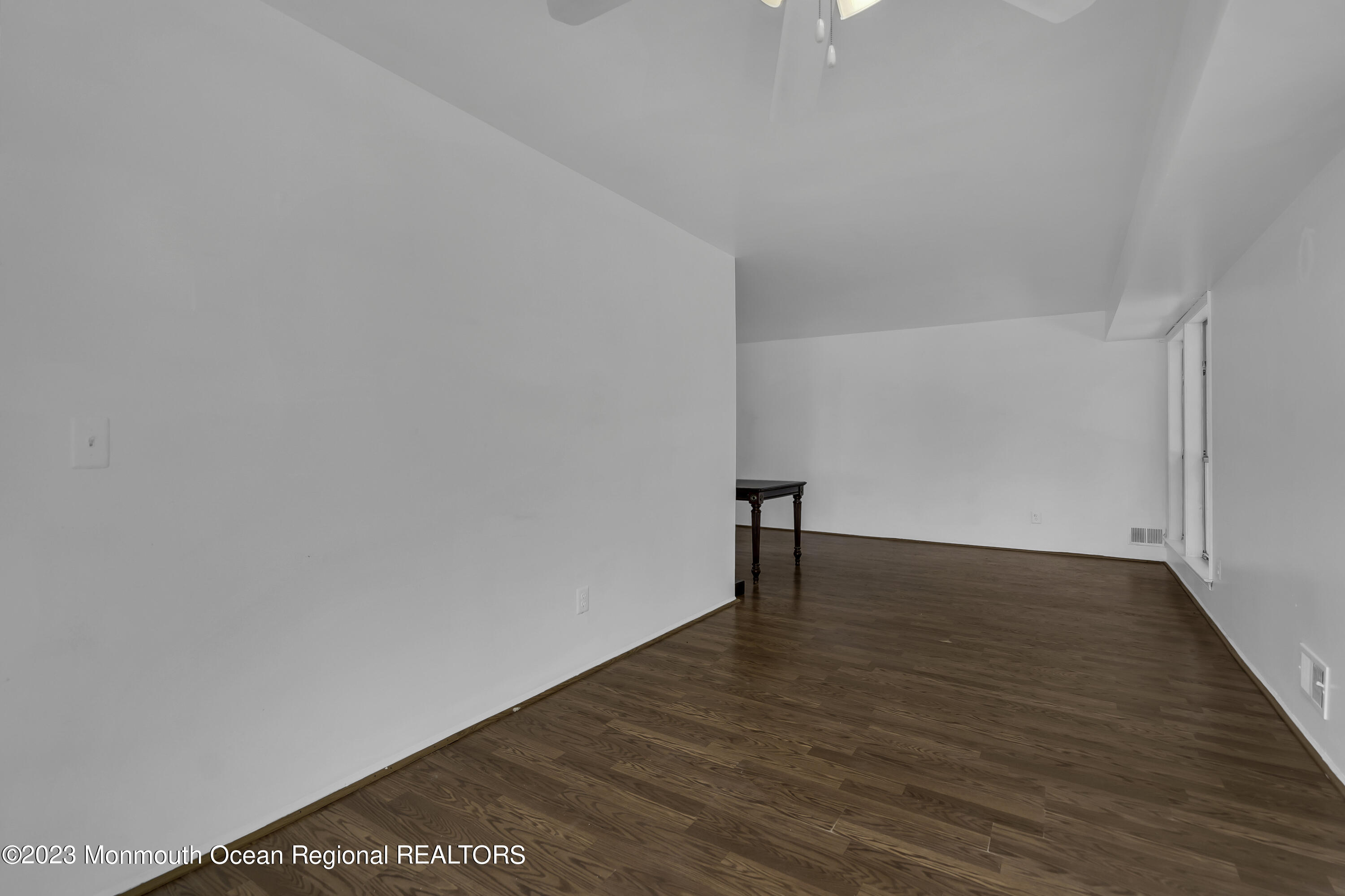 3 Sami Drive Howell, NJ 07731 - Photo 16 of 32 a view of an empty room with wooden floor