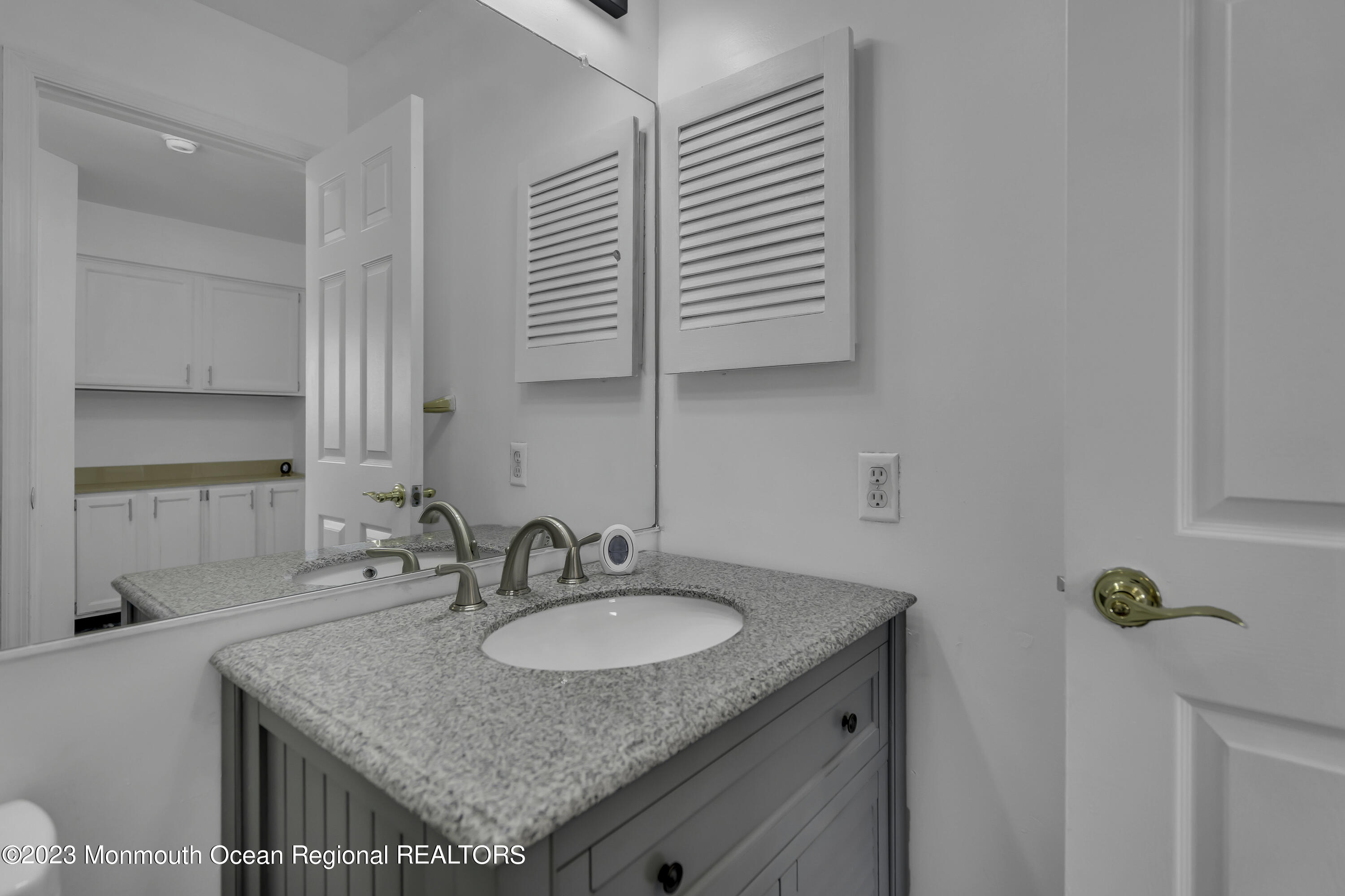3 Sami Drive Howell, NJ 07731 - Photo 20 of 32 a bathroom with a granite countertop sink and a mirror