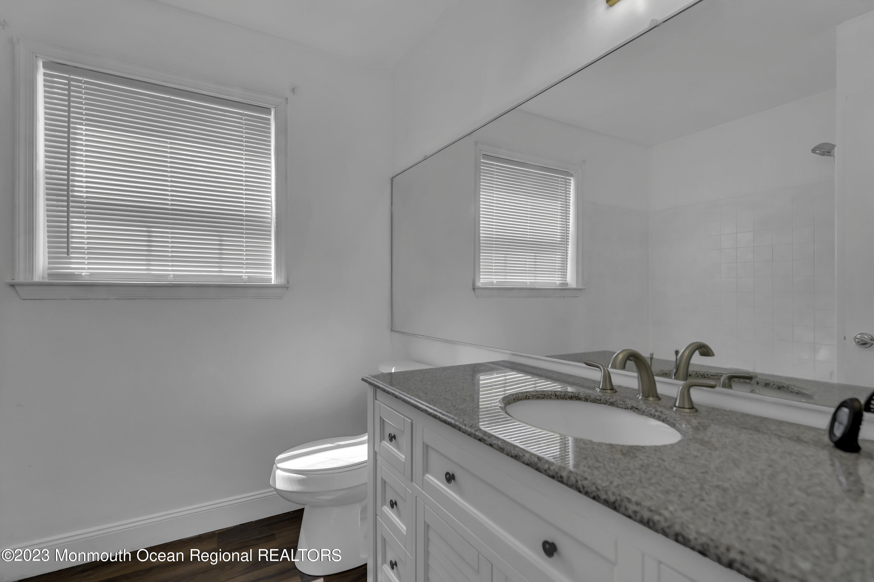 3 Sami Drive Howell, NJ 07731 - Photo 21 of 32 a bathroom with a granite countertop sink toilet and mirror