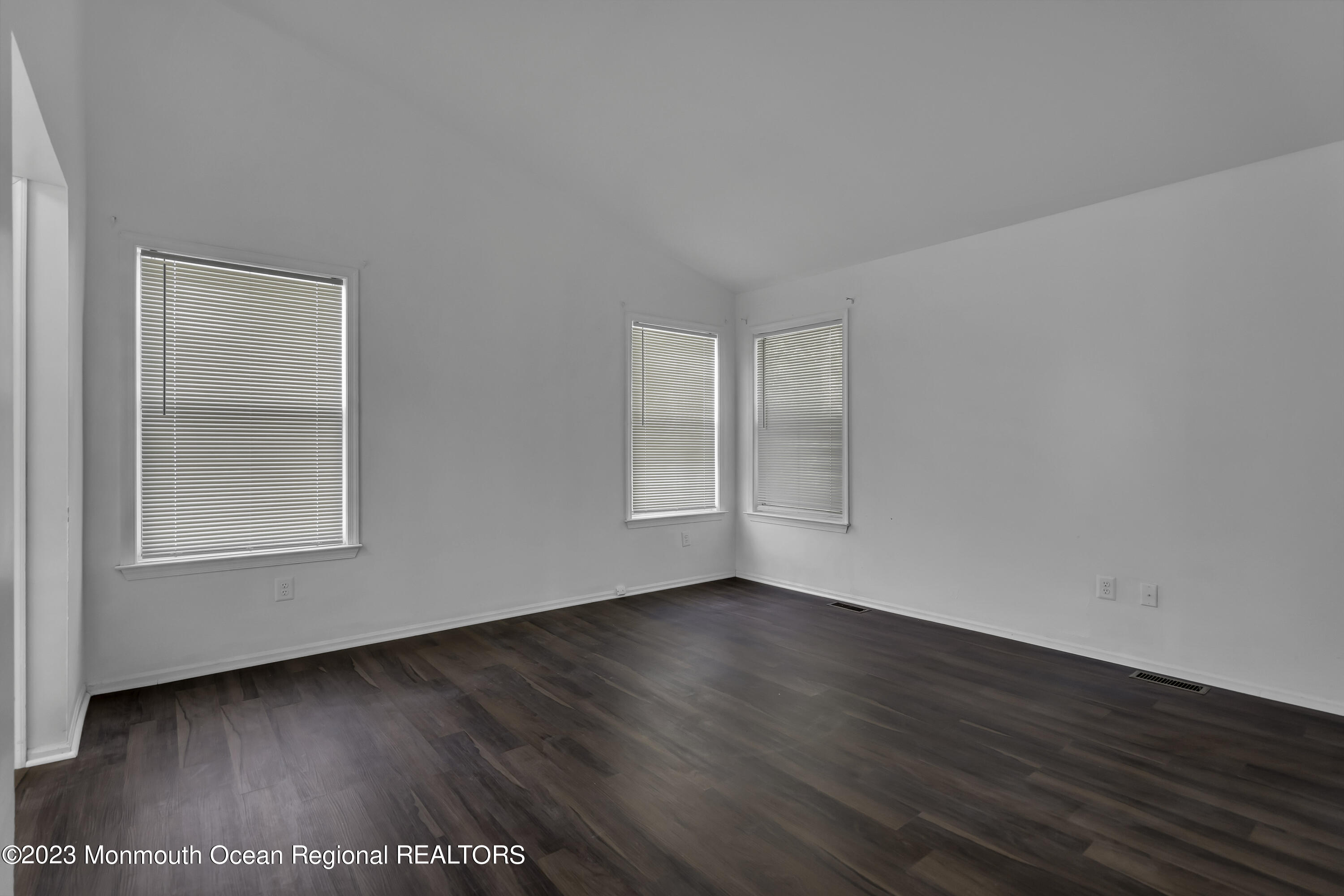 3 Sami Drive Howell, NJ 07731 - Photo 23 of 32 a view of an empty room with wooden floor and a window