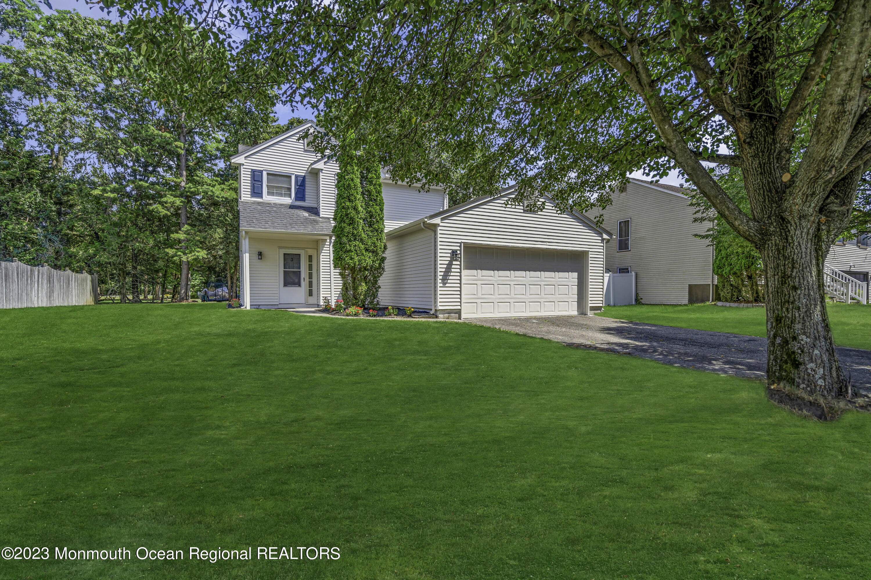 3 Sami Drive Howell, NJ 07731 - Photo 5 of 32 a front view of a house with a garden and yard
