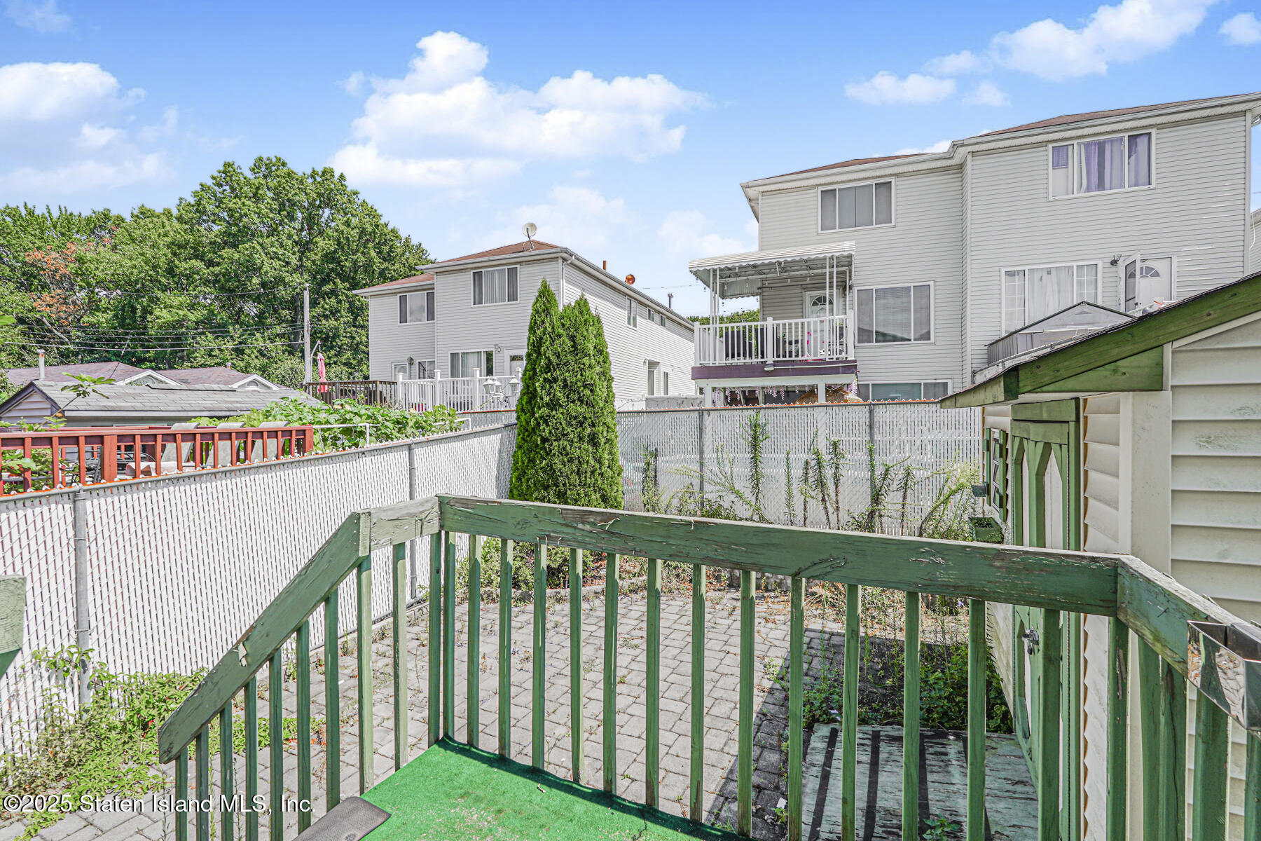 263 Seguine Avenue Staten Island, NY 10309 - Photo 3 of 3 a view of a houses with a street from a balcony