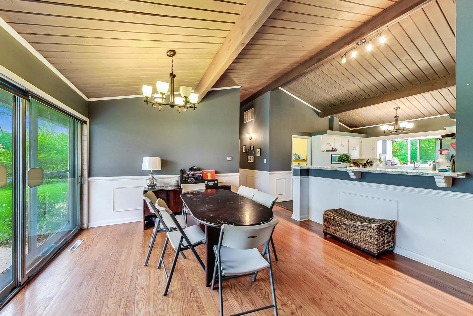12410 South McCarthy Road Palos Park, IL 60464 - Photo 3 of 16 a dining room with furniture and wooden floor