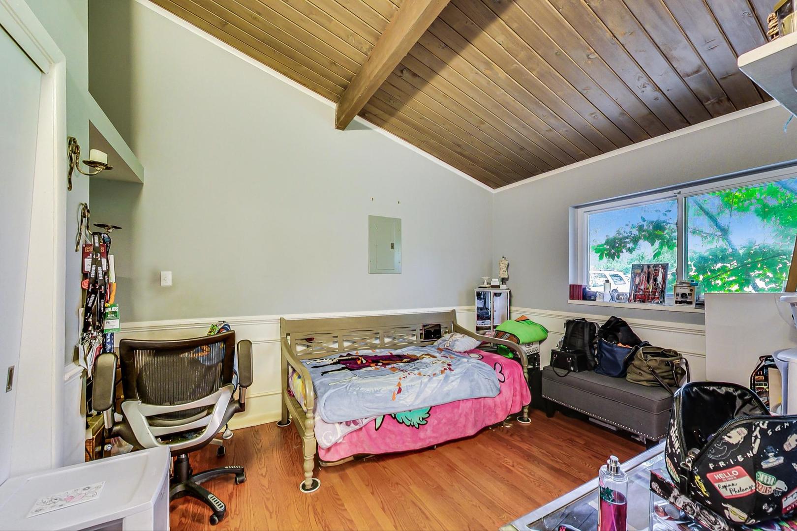 12410 South McCarthy Road Palos Park, IL 60464 - Photo 8 of 16 a bedroom with a bed and a workspace