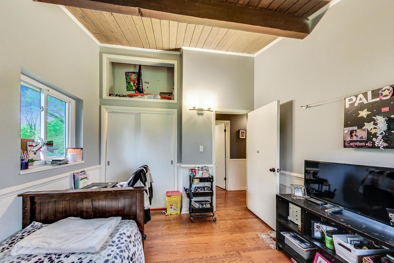 12410 South McCarthy Road Palos Park, IL 60464 - Photo 10 of 16 a bedroom with furniture and a window