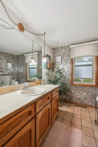 a bathroom with a sink a vanity and a mirror