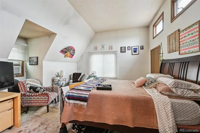 a bedroom with furniture and a bed