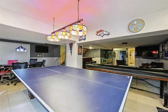 a kitchen with stainless steel appliances granite countertop a sink and a stove