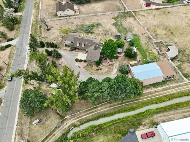 an aerial view of residential house with outdoor space
