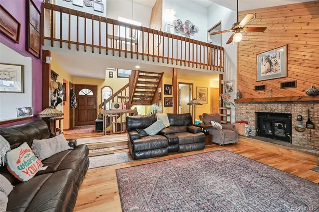 a living room with furniture window and a fireplace