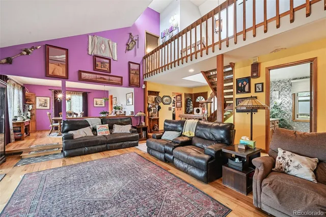 a living room with furniture fireplace and a rug