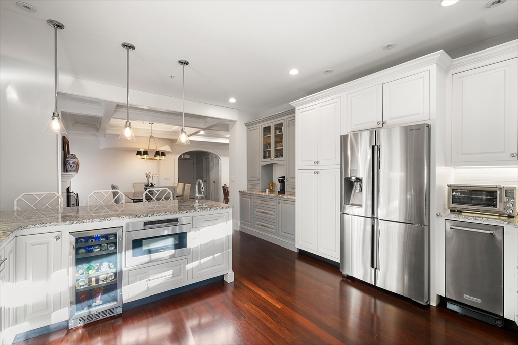 3 Mount Vernon Square, Unit 2 Boston, MA 02108 - Photo 12 of 33 a kitchen with stainless steel appliances a refrigerator and wooden floor