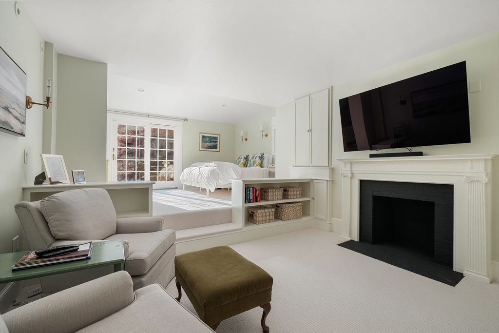 3 Mount Vernon Square, Unit 2 Boston, MA 02108 - Photo 20 of 33 a living room with furniture a fireplace and a flat screen tv