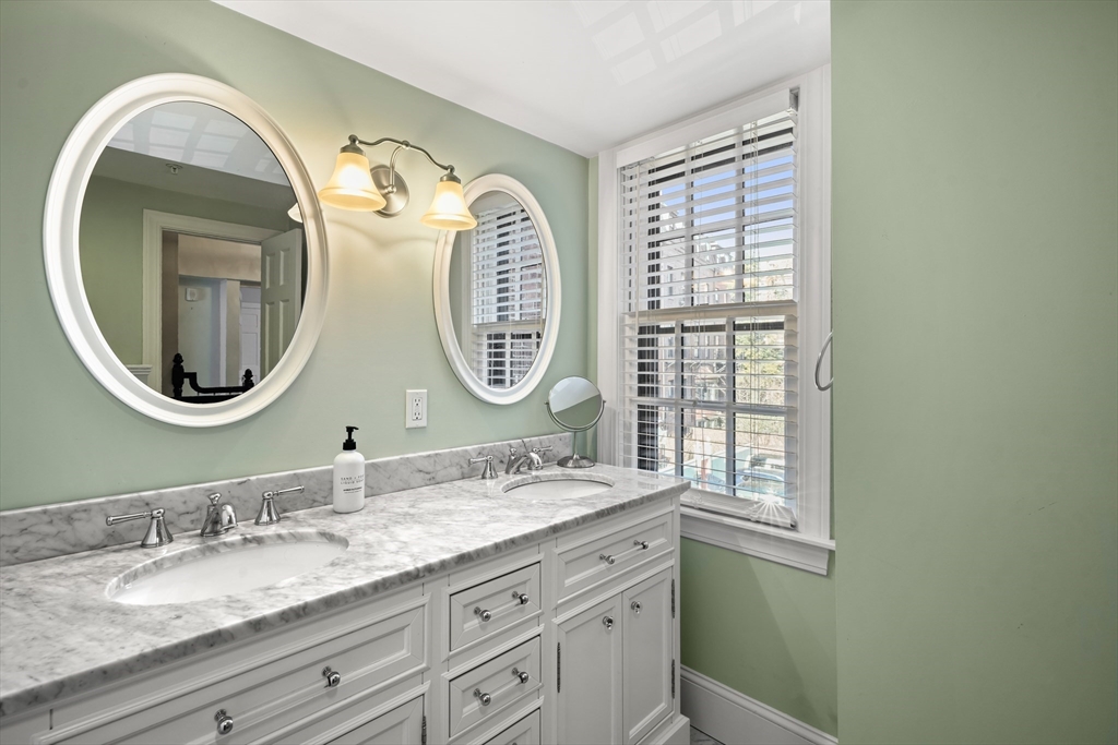 3 Mount Vernon Square, Unit 2 Boston, MA 02108 - Photo 27 of 33 a bathroom with a granite countertop double vanity sink and a mirror