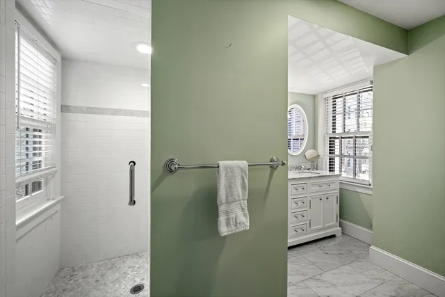 a room with windows and cabinet